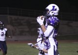 Lemoore's Jerod Holaday holds on for a 2-point conversion to cut Memorial's lead to 23-15 Friday night in Tiger Stadium.